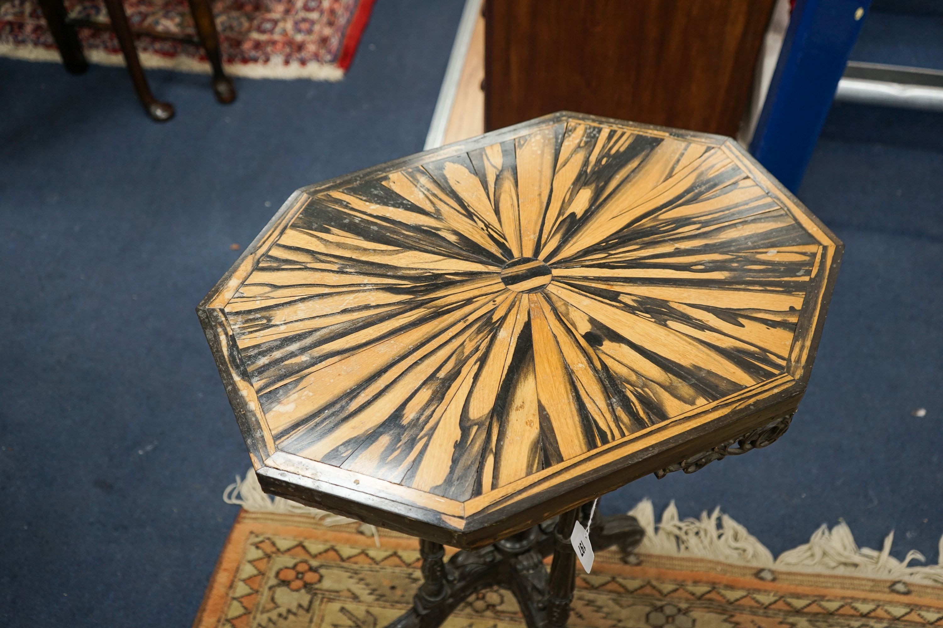 A 19th century Celanese carved ebony and coromandel veneered octagonal occasional table, width 57cm, depth 42cm, height 70cm
